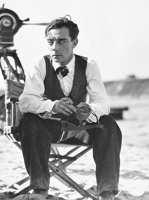 Buster Keaton sitting on a director's chair